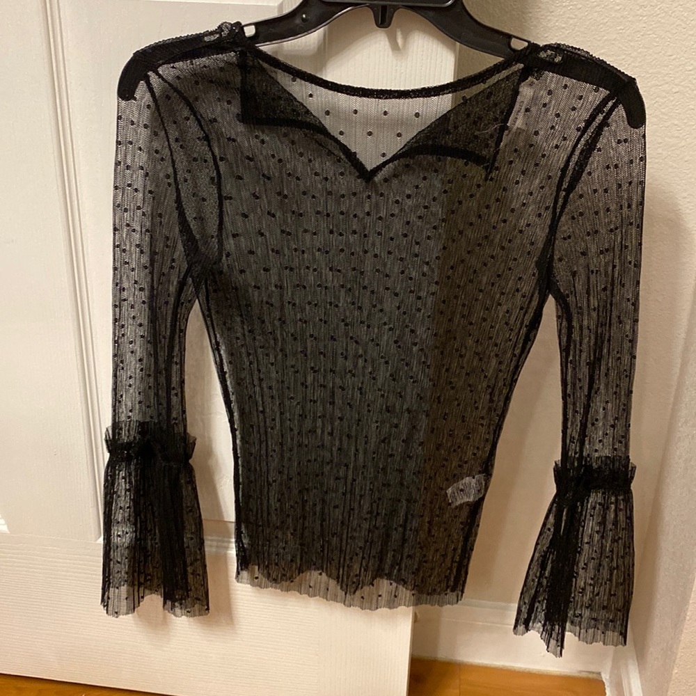 Black see through blouse with ruffle detail in the sleeves